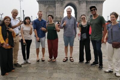 Cultural & Heritage Trails of Old Town Mumbai Guided Walking Tour - What you’ll see near the Gateway of India: water, statues, and quick photo logic