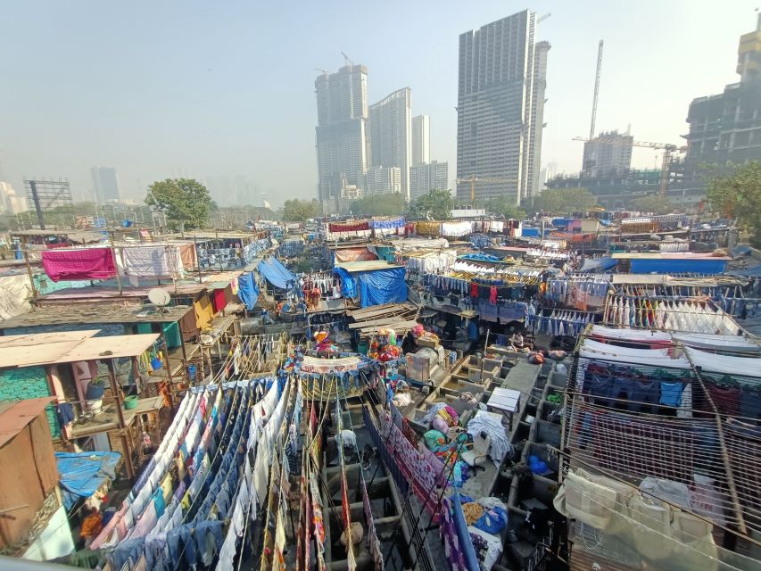 Mumbai: Dhobi Ghat Tour with Dharavi and Train Ride Options - The dhobi shift system: what to look for while you’re there